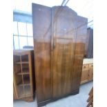 A SHINY WALNUT STONEBRIDGE WARDROBE DATED 1960