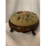 A VICTORIAN FOOTSTOOL WITH A TAPESTRY TOP