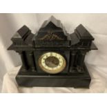 A LARGE SLATE MANTLE CLOCK WITH METAL COLUMNS