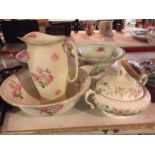 A COLLECTION OF LARGE POTTERY PIECES TO INCLUDE A FLORAL WASH BOWL AND JUG, TWO OTHER WASH BOWLS,