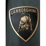 A CAST 'LAMBORGHINI' SIGN