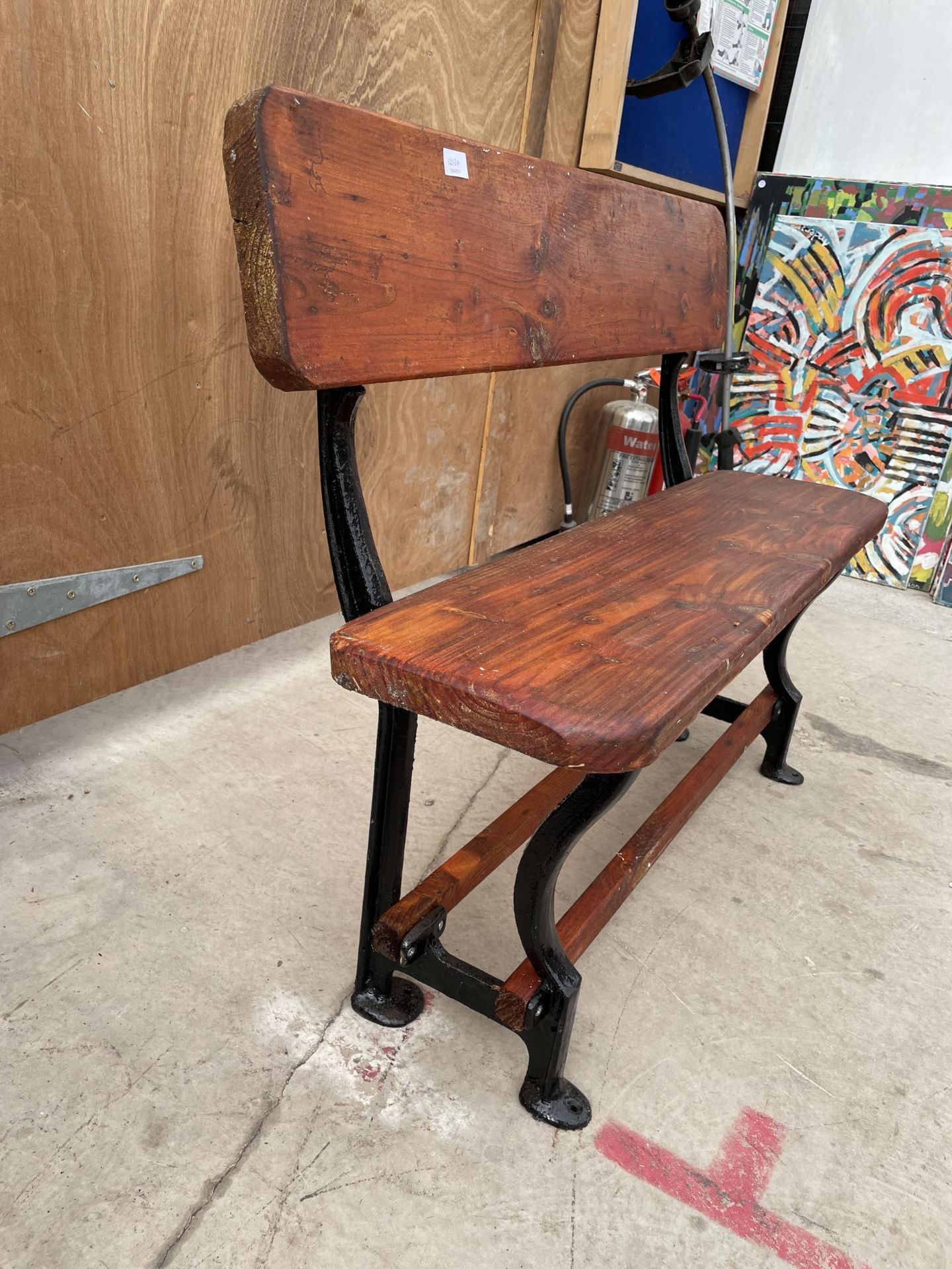 A VINTAGE WOODEN TRAM BENCH WITH CAST ENDS (L:105CM) - Image 2 of 6