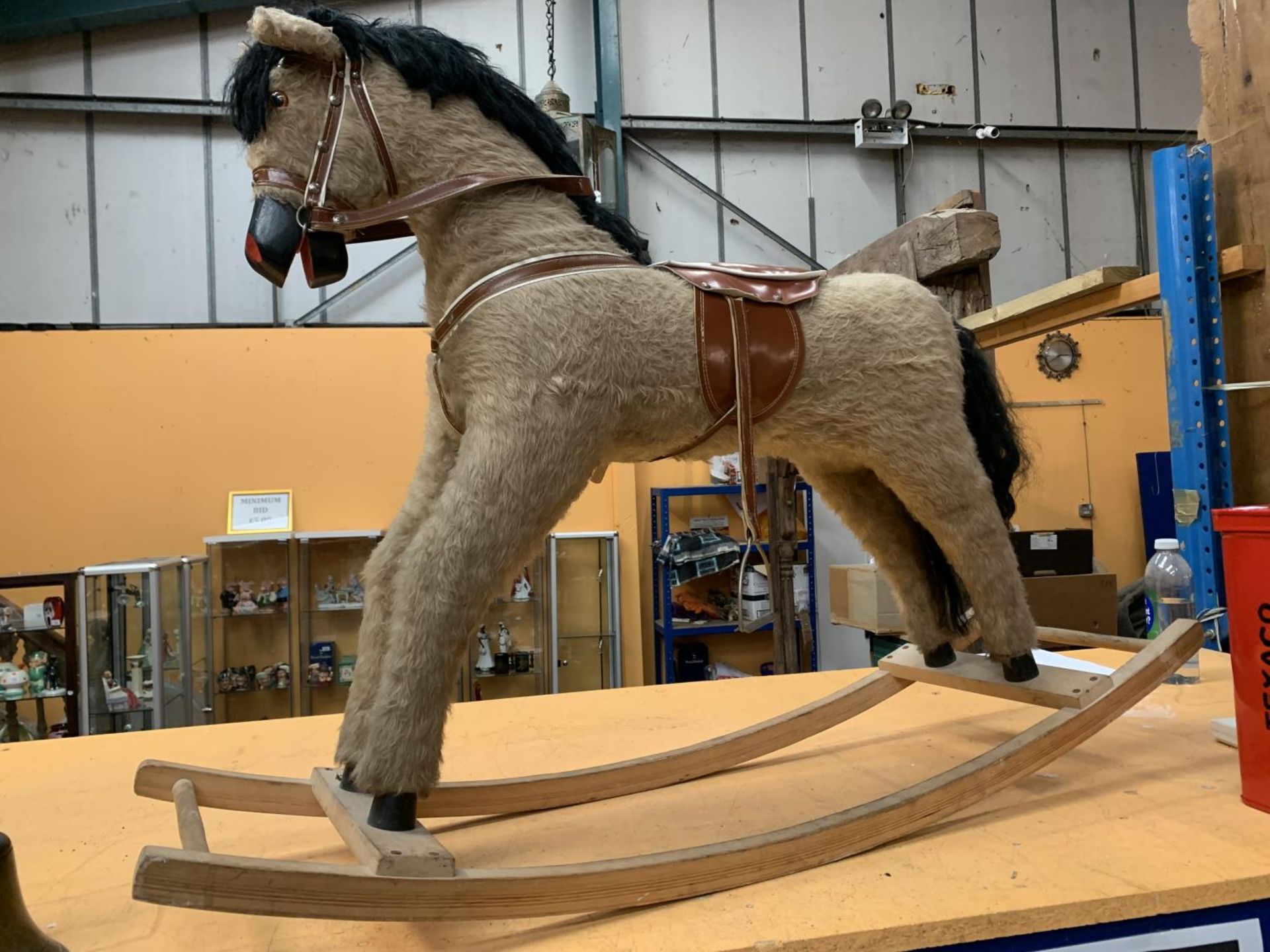 A VINTAGE ROCKING HORSE (ONLY ONE STIRRUP)