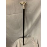 A WOODEN WALKING CANE WITH A SILVER COLOURED FOX HANDLE