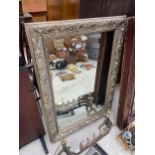 A MODERN GILT FRAMED WALL MIRROR 44" X 31"