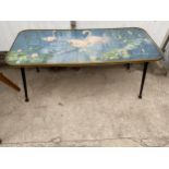 A 1960'S RETRO YELLOW METAL EDGED LONG AND LOW COFFEE TABLE ON BLACK DANSETTE LEGS WITH GLASS TOP