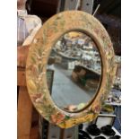 A BOSSONS OVAL MIRROR WITH A FLORAL FRAME MARKED TO REAR