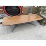 A 1970'S COFFEE TABLE ON METAL SPLAY BASE, LABEL PAT/PEN 32567/63 - 61" X 20"