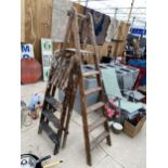 A VINTAGE WOODEN FIVE RUNG STEP LADDER AND A FURTHER THREE RUNG WOODEN STEP LADDER