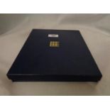 A BLUE CASE CONTAINING TEN GOLD PLATED , ?ROYALTY? COINS , SOME WITH CERTIFICATE OF AUTHENTICITY .