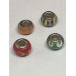 FOUR SILVER AND GLASS BEAD CHARMS