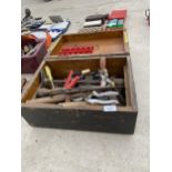 A VINTAGE WOODEN STORAGE CHEST CONTAINING AN ASSORTMENT OF TOOLS TO INCLUDE BRACE DRILL, HAMMERS AND
