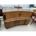 A MID 20TH CENTURY WALNUT SIDEBOARD WITH TAMBOUR DOORS TO UPPER SECTION, CUPBOARD, DRAWERS AND