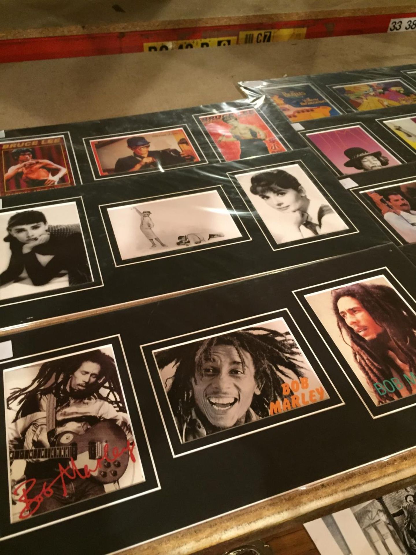 EIGHT MOUNTED PICTURES OF FAMOUS PEOPLE TO INCLUDE THE POP GROUP QUEEN, BOB MARLEY, BRUCE LEE, THE - Image 2 of 3