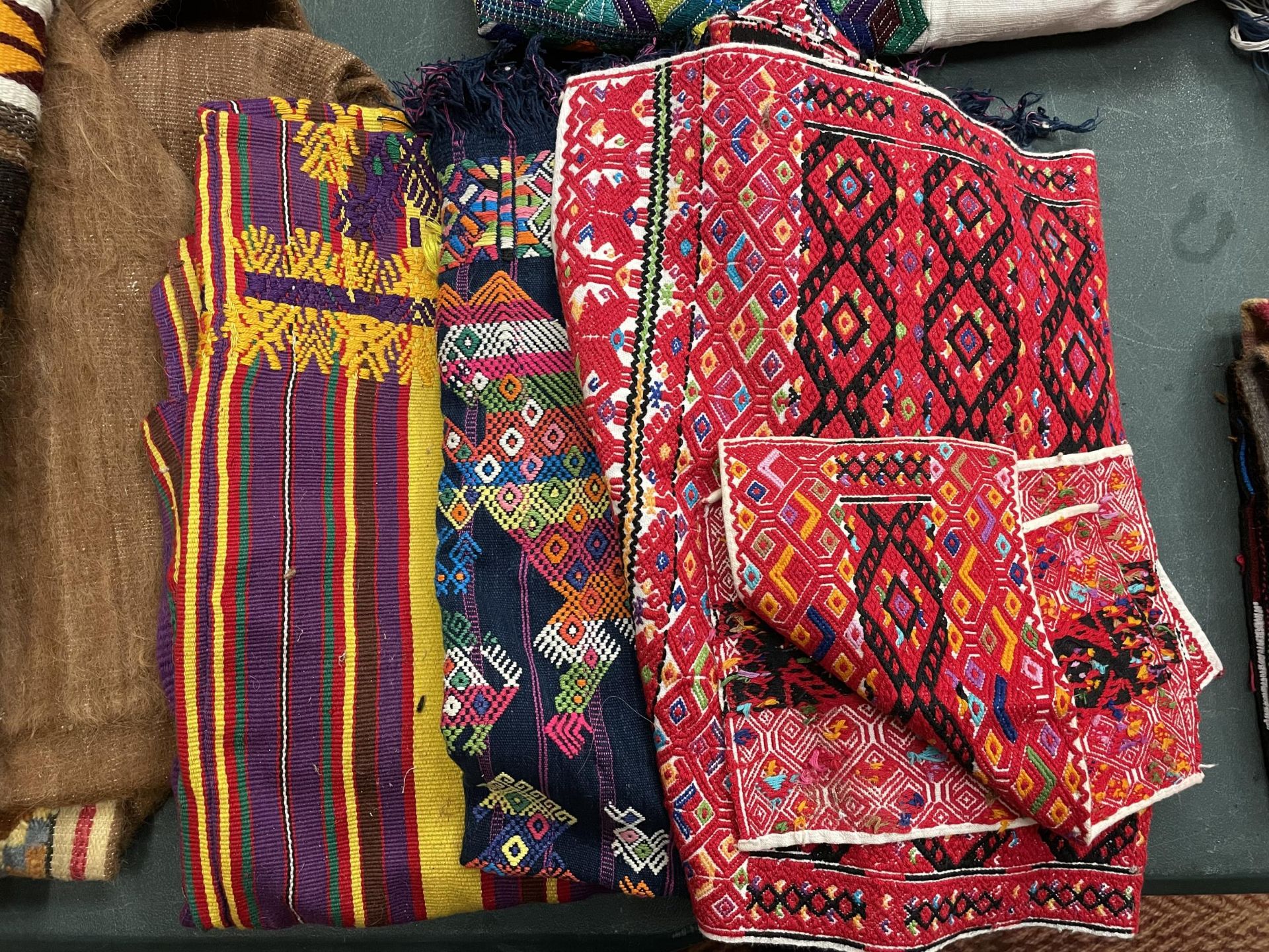 VARIOUS BRIGHTLY COLOURED TEXTILES