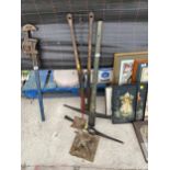 AN ASSORTMENT OF TOOLS TO INCLUDE A PICK AXE, BOLT CUTTERS AND AN AXEL STAND ETC