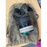A 1937 GAS MASK IN A CANVAS BAG