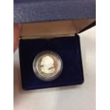 A 1997 SILVER GEURNSEY ONE POUND COIN