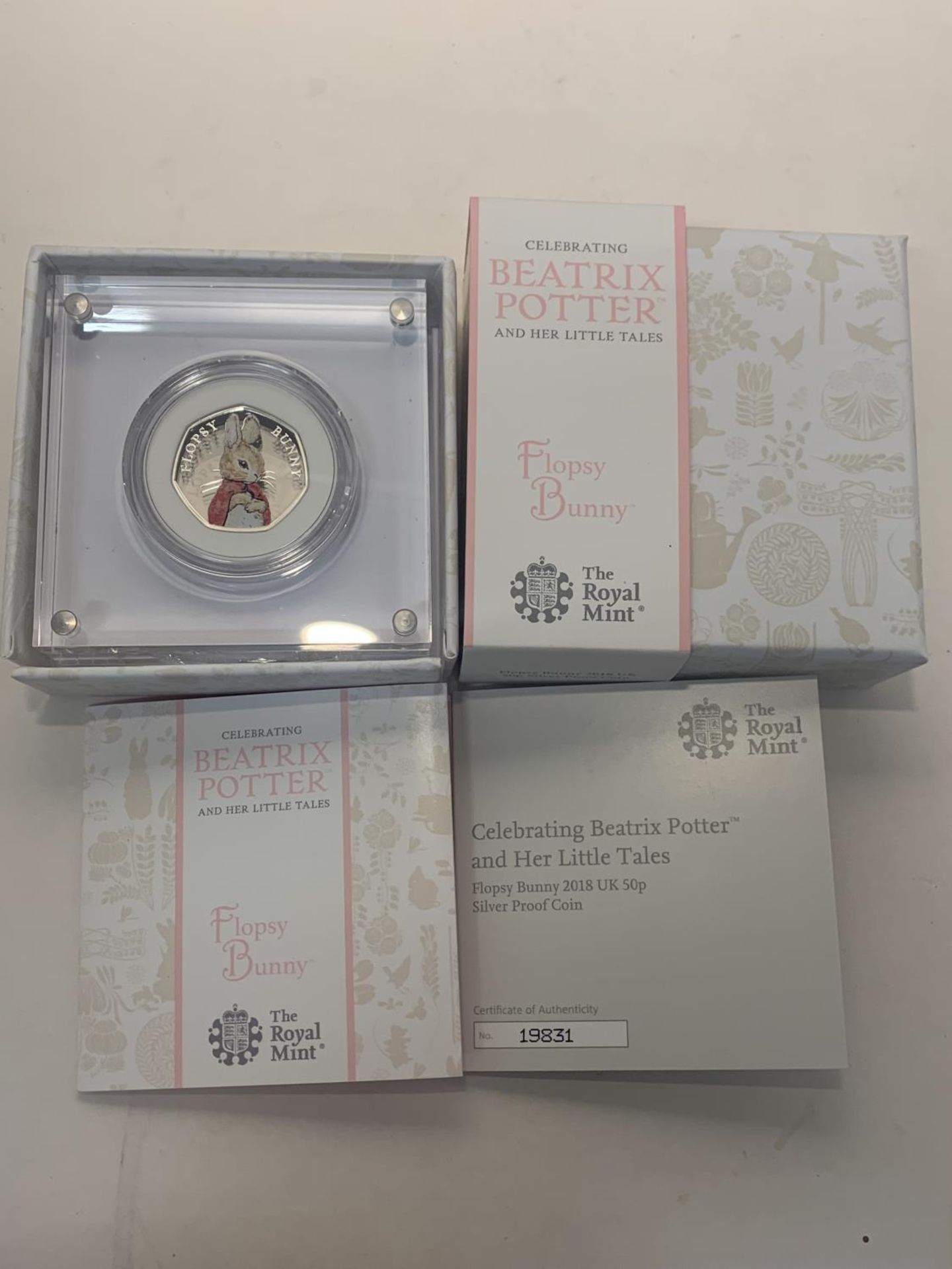 A UK 2018 BEATRIX POTTER FLOPSY BUNNY 50P SILVER PROOF COIN WITH CERTIFICATE OF AUTHENTICITY