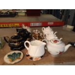 A QUANTITY OF TEAPOTS AND TEAPOT STANDS TO INCLUDE SHELLEY, WORCESTER EVESHAM, ETC