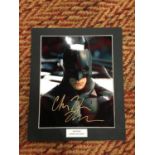 A MOUNTED SIGNED PICTURE OF CHRISTIAN BALE PLAYING BATMAN