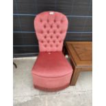 A MODERN 'ROYAL PRIDE' PINK BUTTON BACK BEDROOM CHAIR