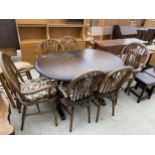 A REPRODUCTION REFECTORY STYLE DINING TABLE AND FOUR WHEEL-BACK WINDSOR STYLE CHAIRS AND TWO CARVERS