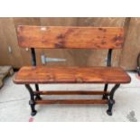 A VINTAGE WOODEN TRAM BENCH WITH CAST ENDS (L:105CM)