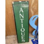 A VINTAGE WOODEN 'RUTLAND ANTIQUES' SIGN