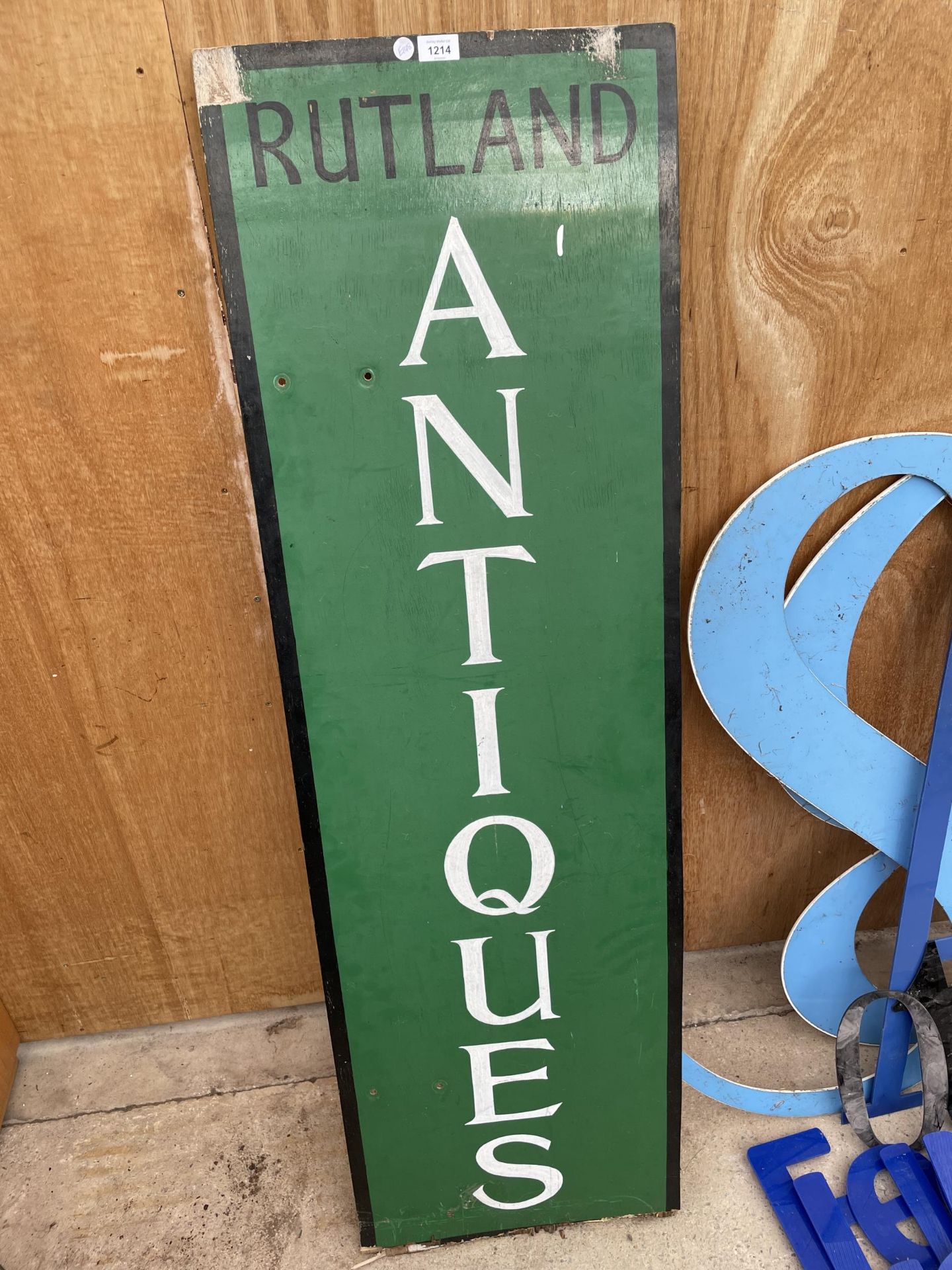 A VINTAGE WOODEN 'RUTLAND ANTIQUES' SIGN