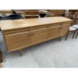 AN ALFRED COX RETRO WALNUT SIDEBOARD WITH FOUR DOORS AND FOUR DRAWERS - 81" WIDE