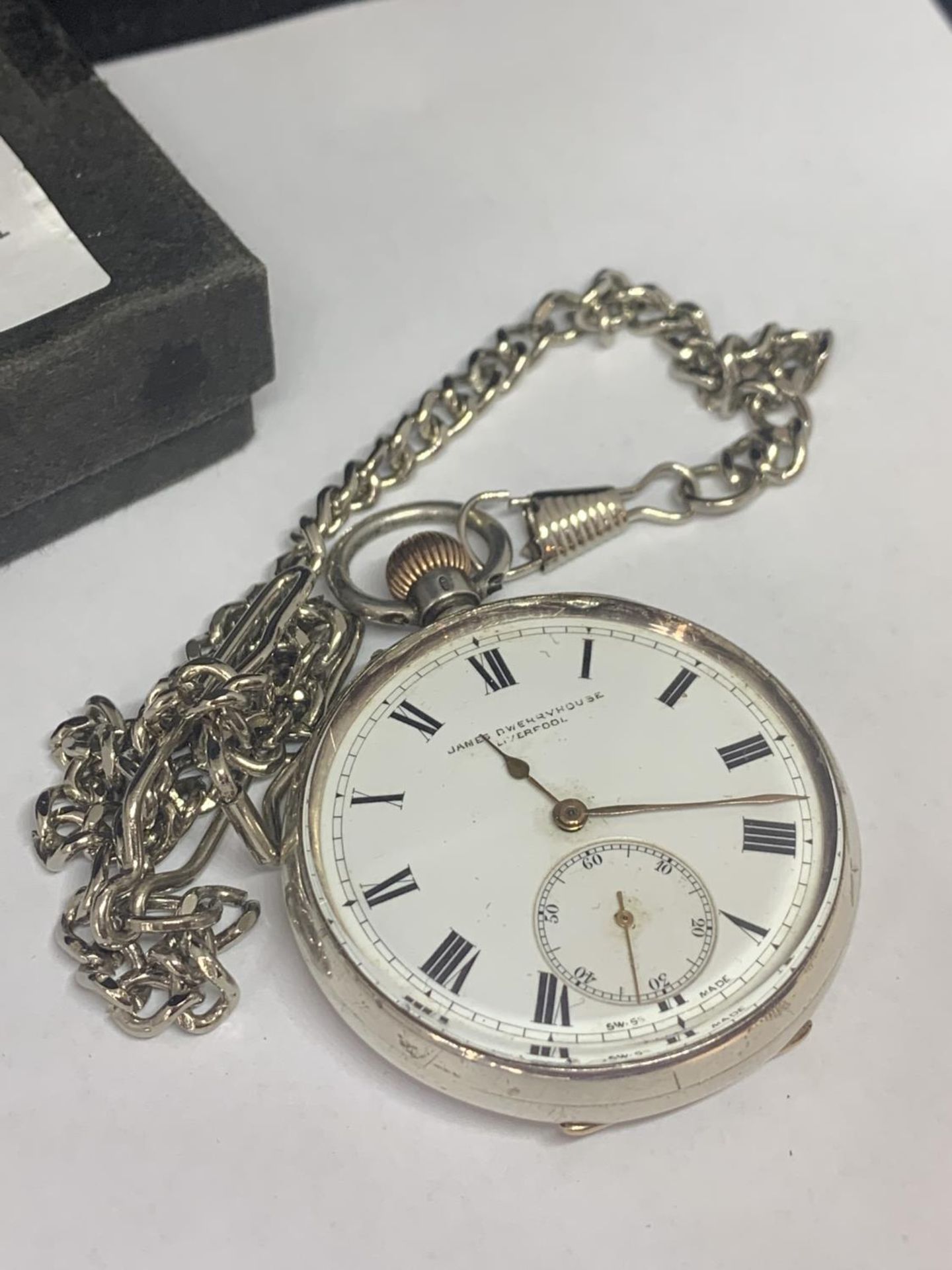 A MARKED 925 SILVER POCKET WATCH WITH A CHAIN SEEN WORKING BUT NO WARRANTY