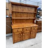 A MODERN PINE DRESSER WITH PLATE RACK 54" WIDE