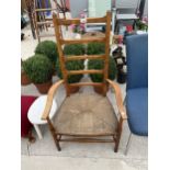 AN ARTS & CRAFTS STYLE BEECH RUSH SEATED LADDER BACK CHAIR