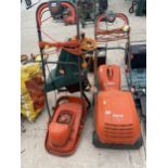 A FLYMO LAWNRAKE COMPACT 340, A GARDEN SHREADER AND A FURTHER LAWN MOWER