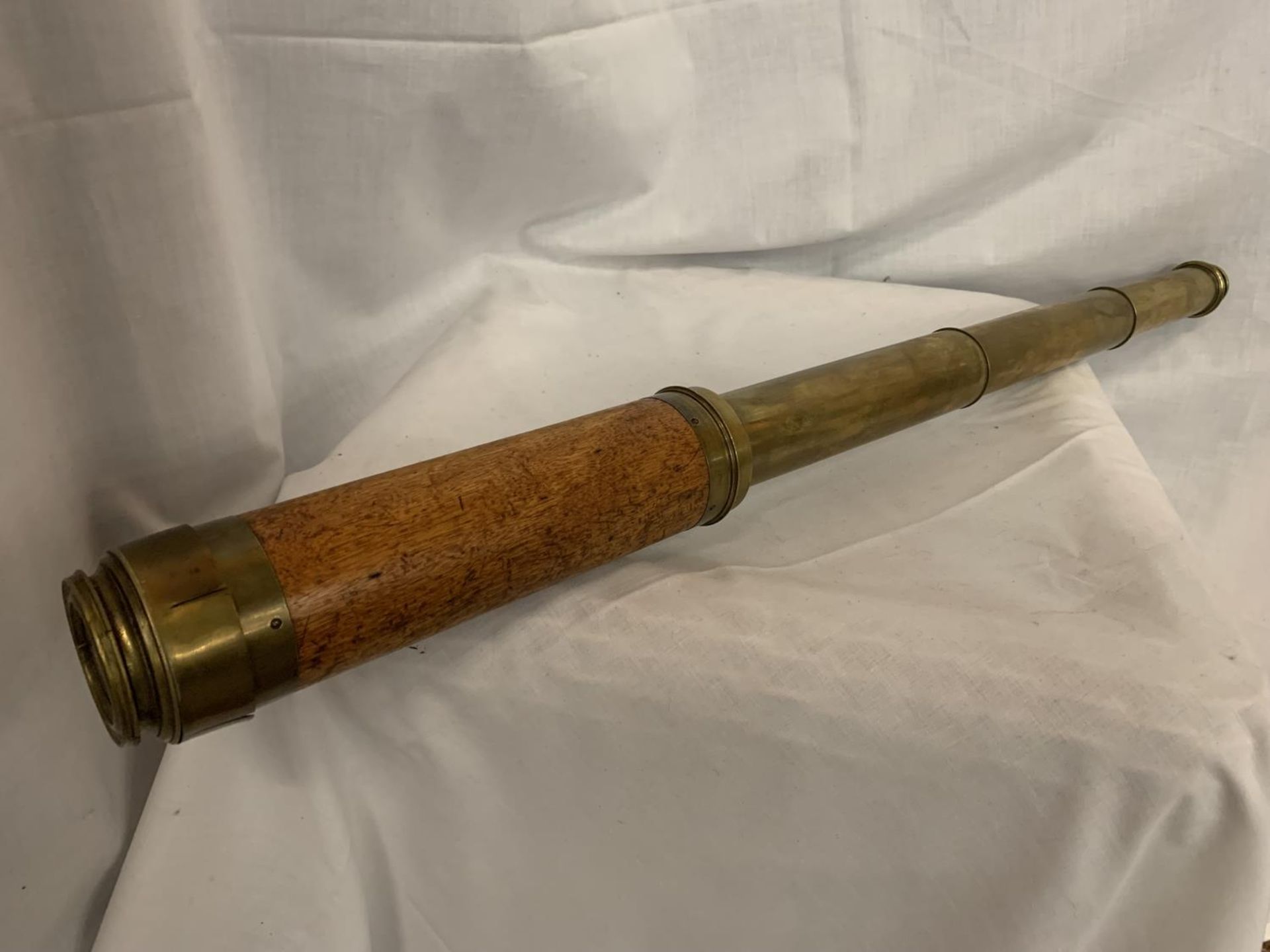 A VINTAGE BRASS AND WOOD TELESCOPE