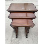 A NEST OF THREE MAHOGANY TABLES