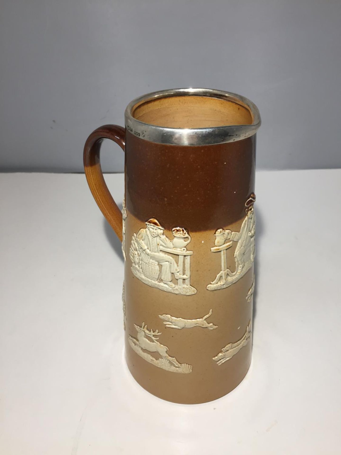 A 1898 DOULTON LAMBETH SILVER RIMMED HUNTING JUG - Image 3 of 5