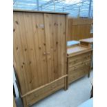 A MODERN PINE TWO DOOR WARDROBE AND MATCHING WINDSOR CHEST OF THREE DRAWERS