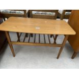 A RETRO TEAK COFFEE TABLE WITH SLATTED LOWER MAGAZINE SHELF - 30" X 15"