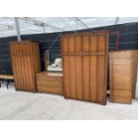 A MID 20TH CENTURY OAK 'AUSTINSUITE' BEDROOM SUITE COMPRISING OF TWO WARDROBES, DRESSING CHEST AND