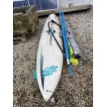 A HIFTY WIND SURFING BOARD WITH SAILS ETC