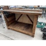 A VINTAGE WOODEN WORK BENCH WITH WITH RECORD NO.52 BENCH VICE