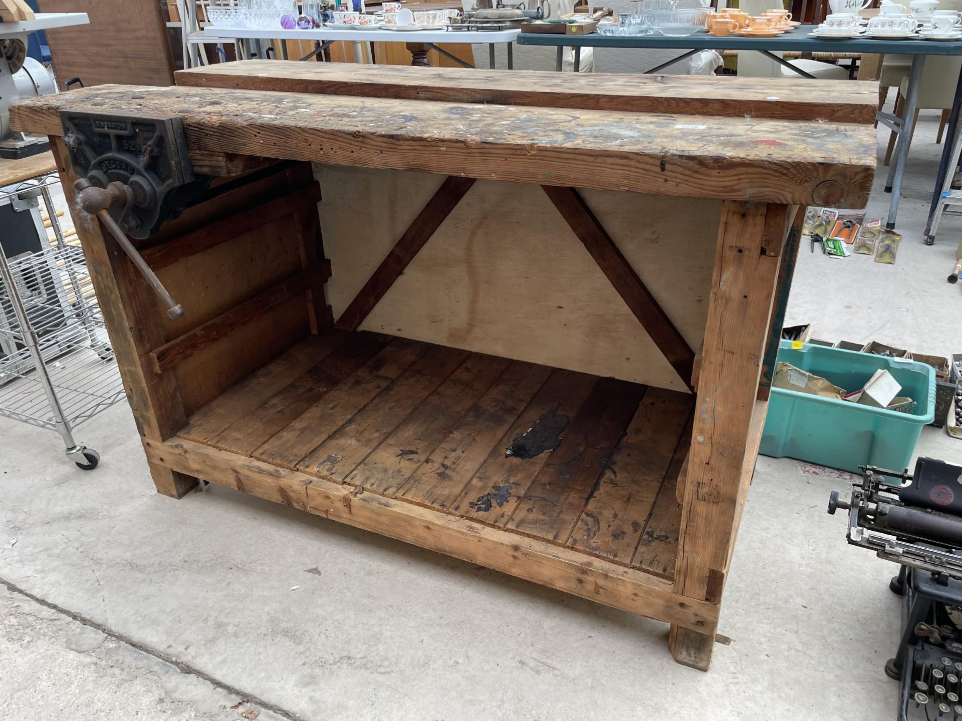 A VINTAGE WOODEN WORK BENCH WITH WITH RECORD NO.52 BENCH VICE