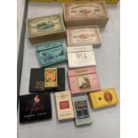 A COLLECTION OF VINTAGE CIGARETTE BOXES, SOME OF WHICH CONTAIN CIGARETTES