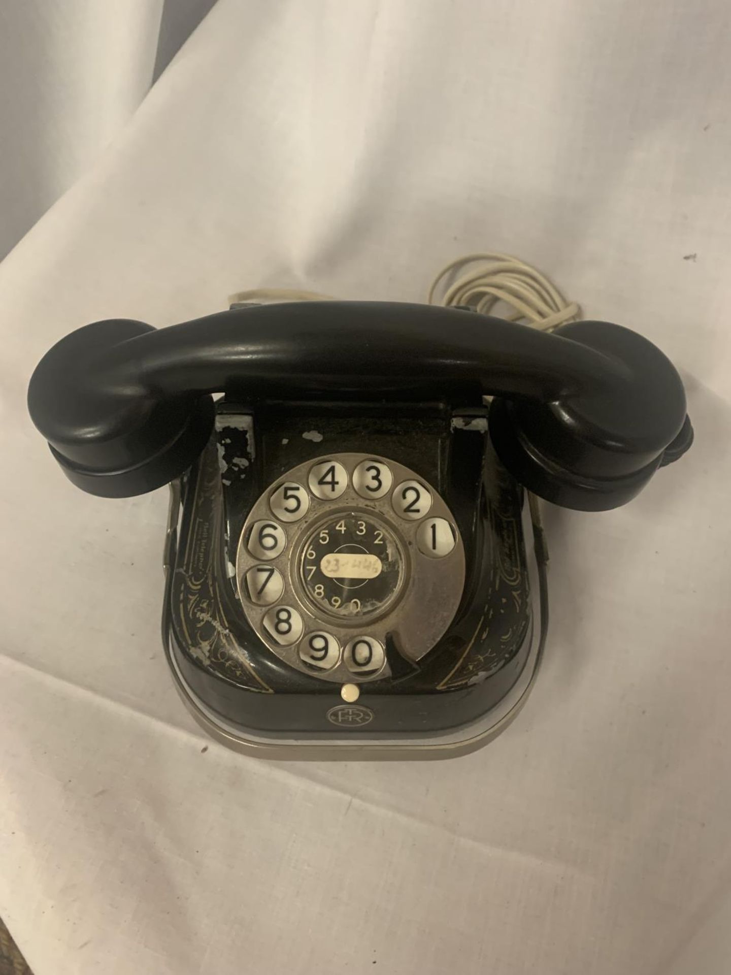 A VINTAGE BLACK TELEPHONE WIRED FOR MODERN USE