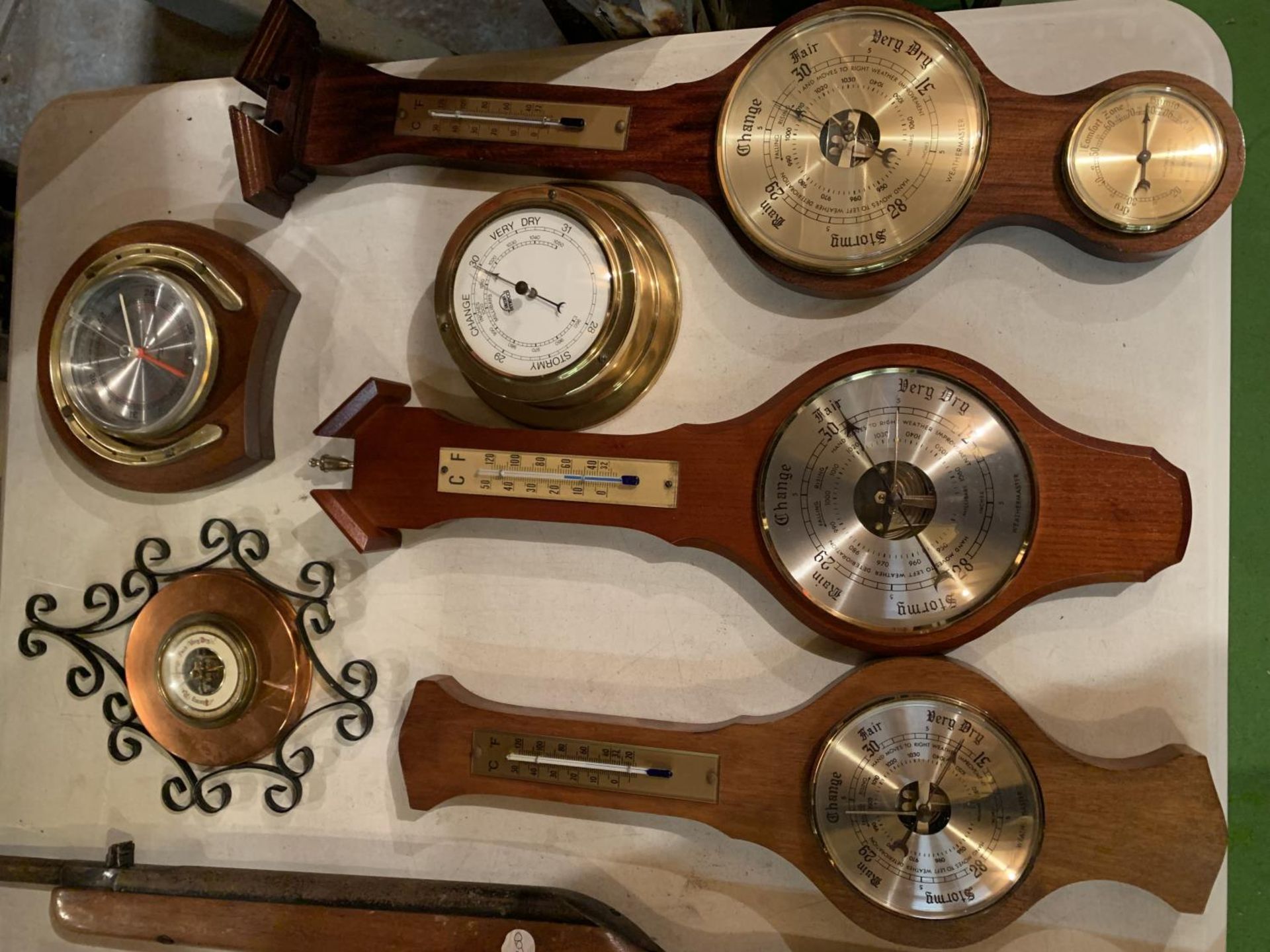 A COLLECTION OF SIX VARIOUS DESIGNS OF BAROMETER