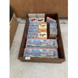 A WOODEN STORAGE CHEST CONTAINING AN ASSORTMENT OF RETRO CHILDRENS GAMES