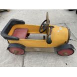 A CHILD'S METAL BRUM PEDAL CAR, IN WORKING ORDER