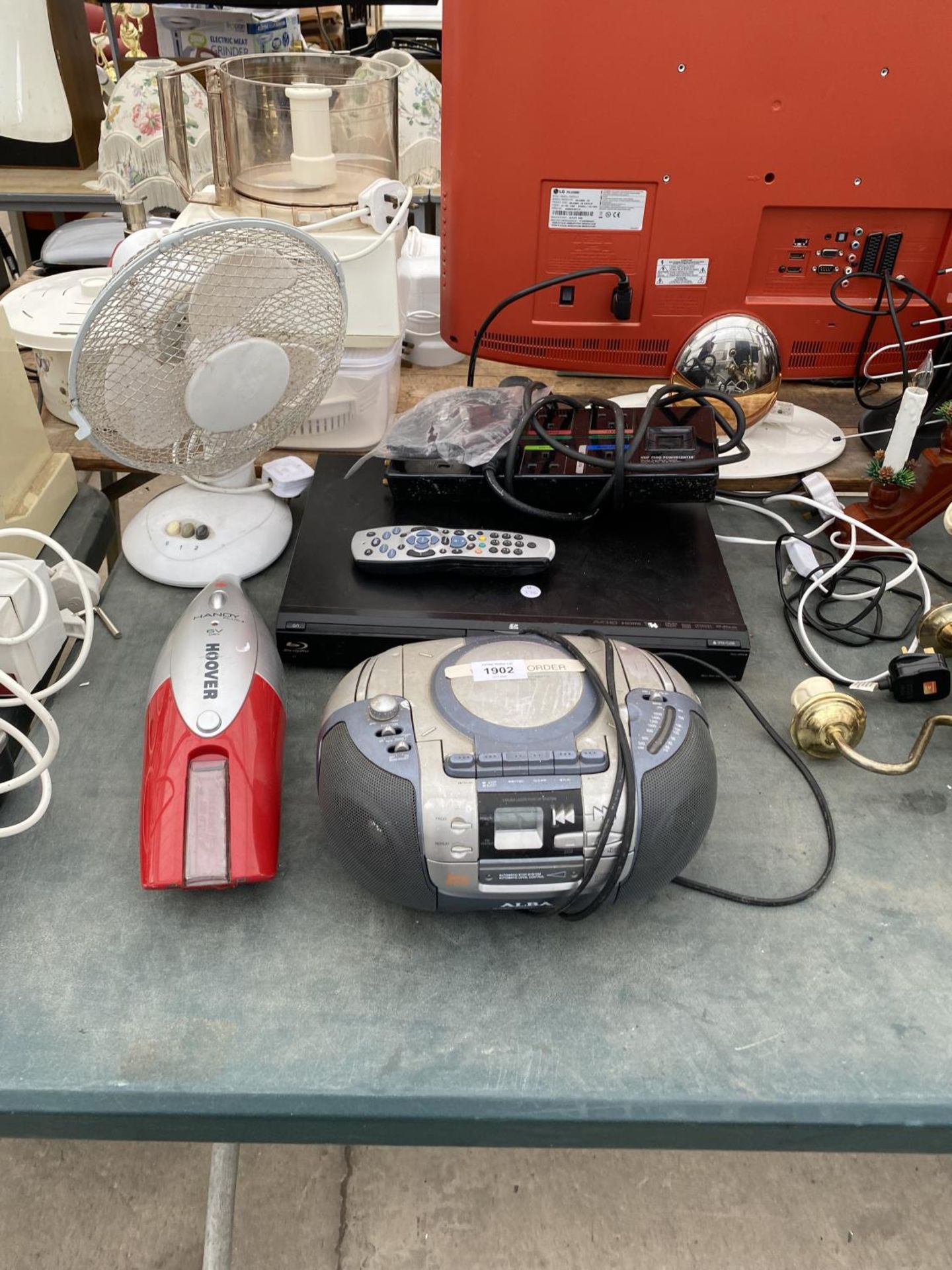 AN ASSORTMENT OF ITEMS TO INCLUDE AN ALBA CD PLAYER, A PANASONIC BLURAY PLAYER AND A HANDHELD HOOVER